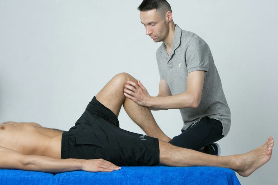 A sports doctor examining an athlete's knee